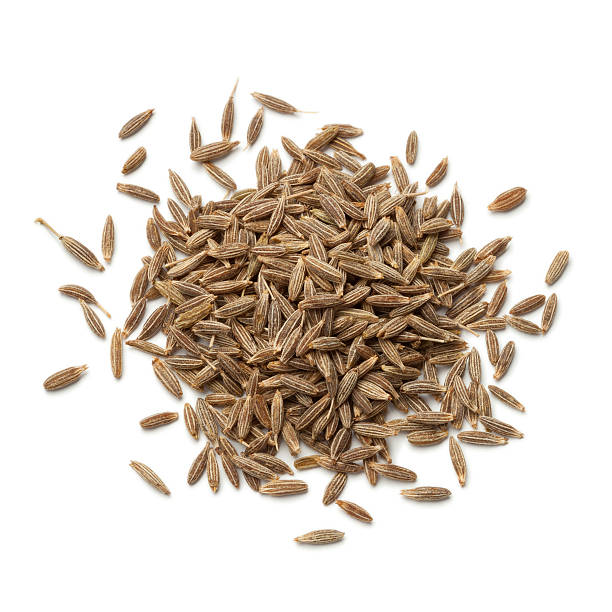 Heap of dried cumin seeds on white background
Cuminum cyminum